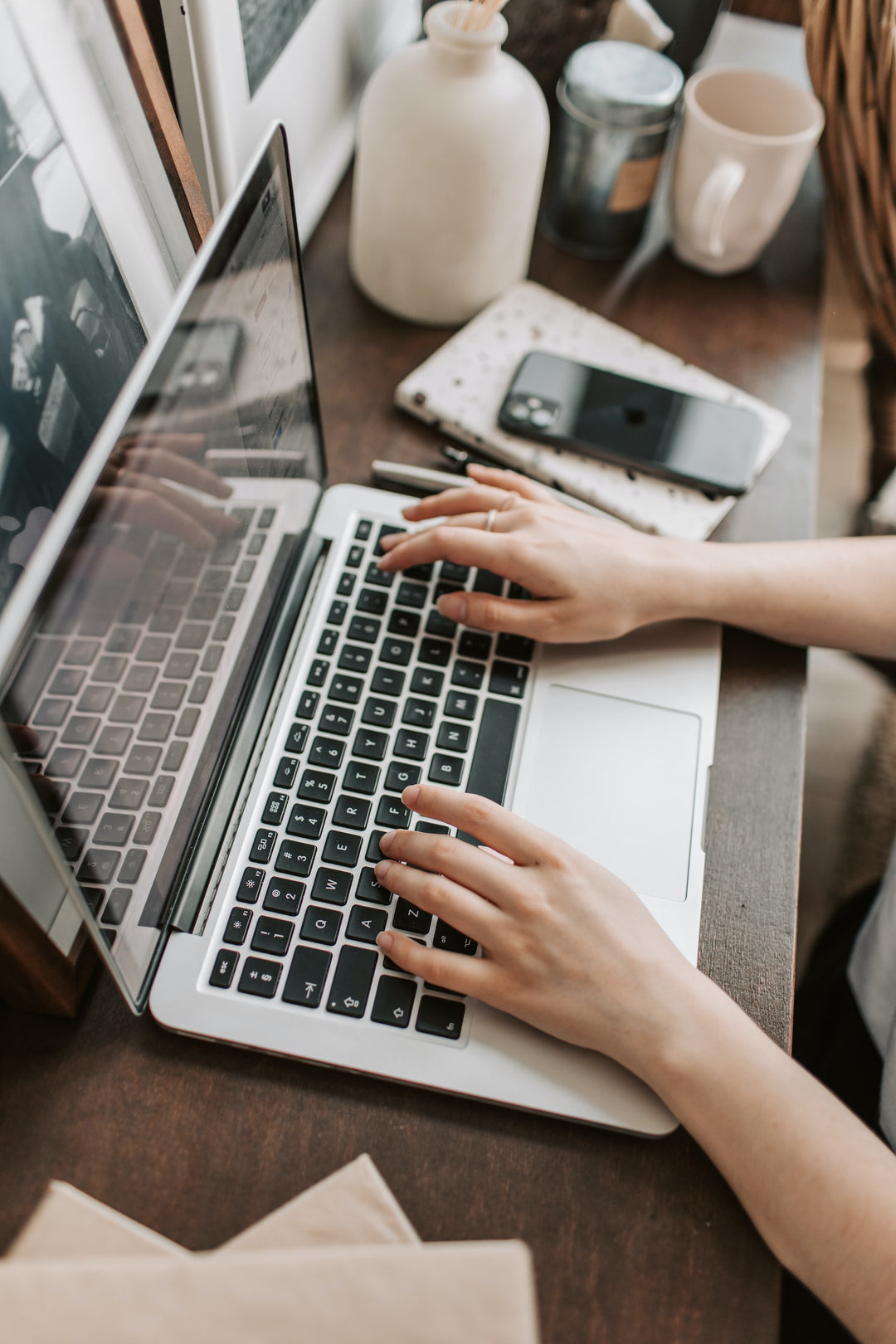 Someone typing on a laptop
